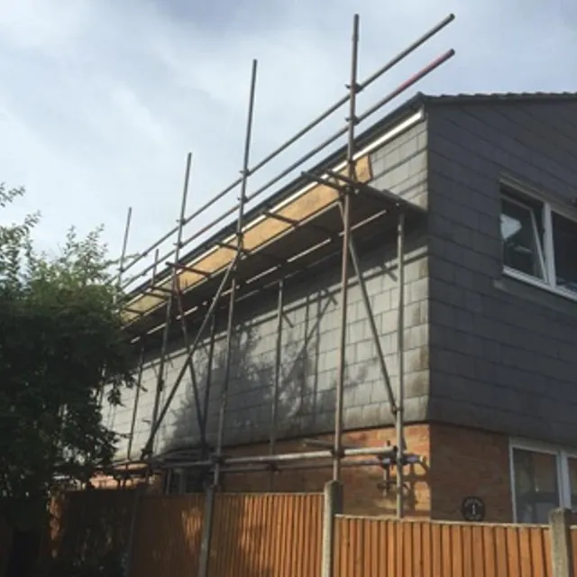 House with Scaffolding for roof repairs